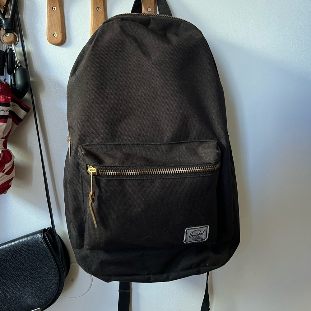 High quality Herschel backpack. 2 pockets, laptop insert & wired headphone spot